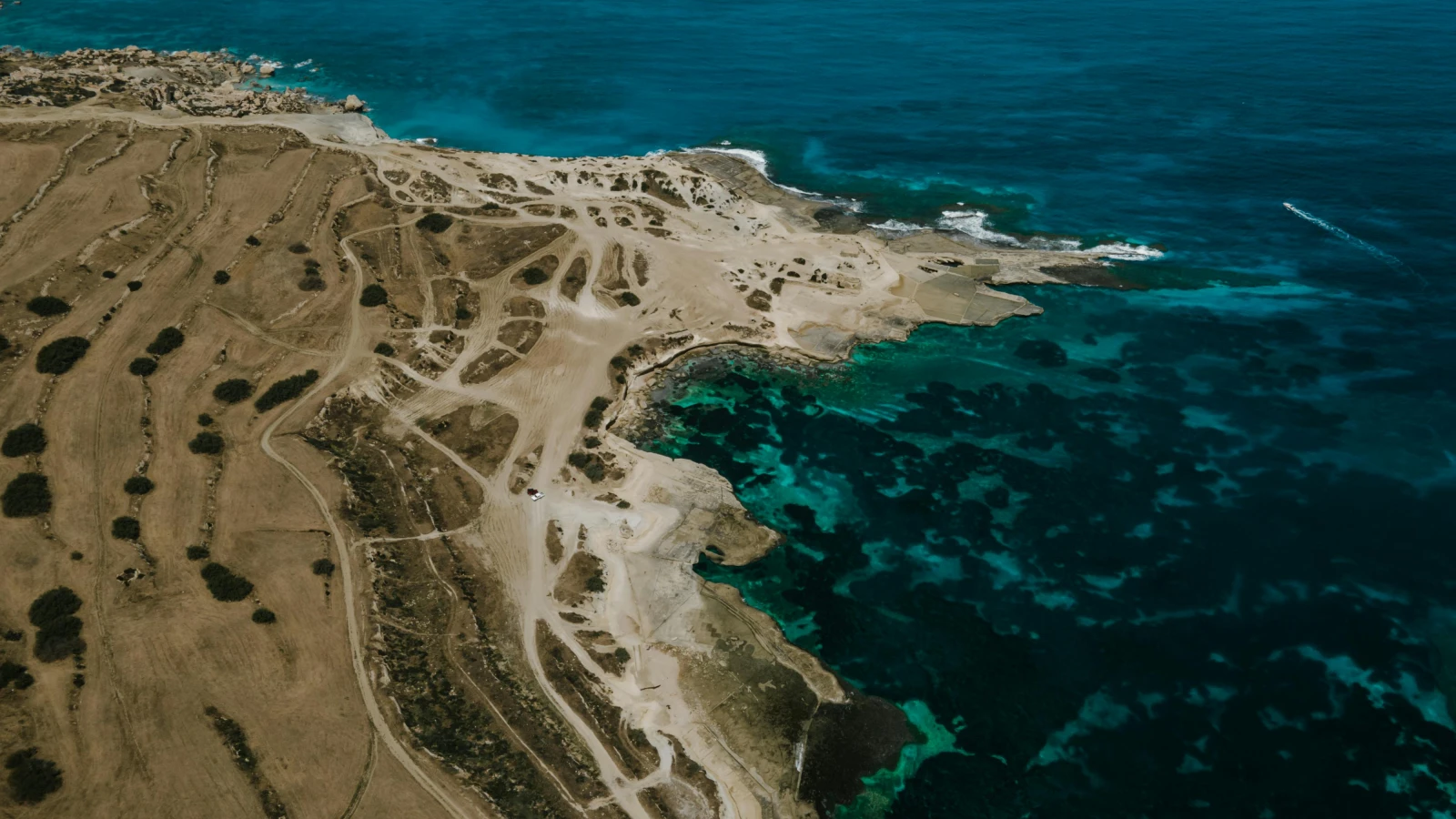 Drone shot of stunning Ayia Napa coastline for scenic driving routes by rental car